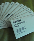 Front view of TIFFEN Lens Cleaning Paper packs, white, 50 sheets each, fanned display