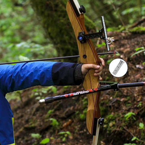 Archer holding bow with 24 Pack Aluminum Arrow Inserts For Carbon Shafts.244 Inch / 6.20mm in forest setting