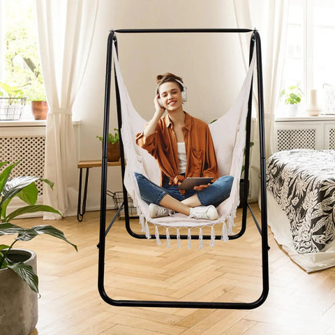 Woman relaxing in Hammock Chair With Rope Swing, Macrame Boho Hanging Chair With 2 Cushions for Indoor And Outdoor Living.
