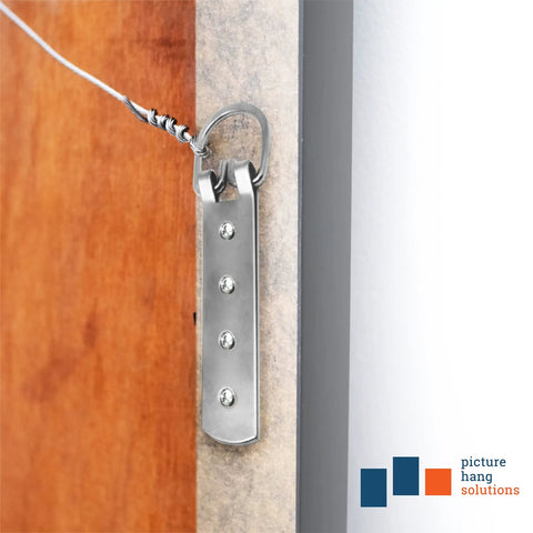 Side view of Beefy Heavy Duty D Ring Picture Hangers 2 Pack With Screws 200 Lb Capacity 6.5 Inch Steel Strap Hooks attached to a frame.