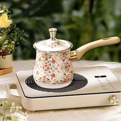 Decorative pot with floral design and wooden handle on stovetop, Stainless Steel Turkish Coffee Pot 500ml Stovetop Coffee Maker