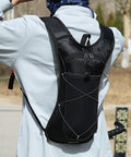 Person wearing All Day Hydration Pack Backpack With Reflective Strips And Lightweight Nylon Reservoir, Ideal For Hiking