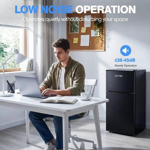 Straight Up Game Changer 3.2 Cubic Foot Mini Fridge With Separate Freezer in a home office setup, quiet operation, sleek black design.