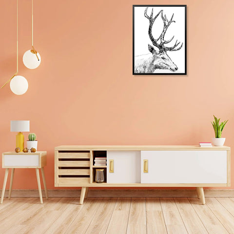 Modern living room with minimalist furniture, deer artwork on peach wall, wooden sideboard, plants, and pendant lights.