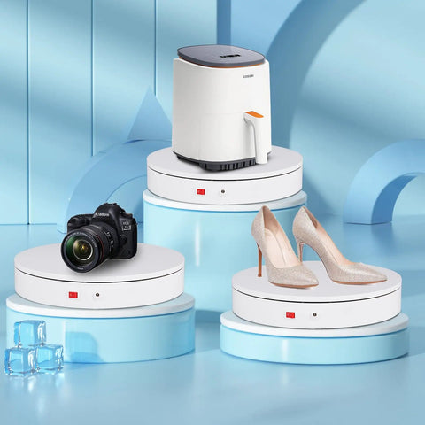ComXim Motorized Turntable Remote Control Rotating Display Stand 360 Degree Platform showcasing shoes, camera, and appliance on white disks.