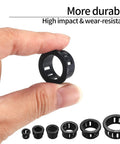 Hand holding one black grommet from 170 Pcs Black Round Nylon Cable Snap Grommets Set Durable PA66 Material Snap In Grommet Protectors Assorted Sizes