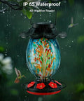 Solar Powered Hummingbird Feeder With 49 Fl Oz Capacity Hand Blown Blue Glass Color Changing Night Glow Seven Feeding Ports With Perch Never Leaks Outdoor Hanging For Your Yard