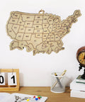 Wooden USA Map Wall Decor For Travel Buffs With All 50 State Abbreviations Engraved Ornament above desk with globe