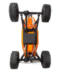 RBX10 Ryft 4WD Brushless RC Rock Bouncer bottom view showing solid axles, rugged tube chassis, and Raceline wheels.