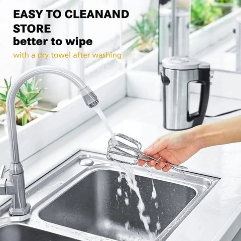 Hand cleaning turbo beaters for hand mixers under running water in kitchen sink