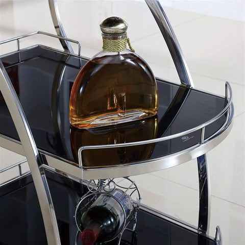 Rustic Industrial Kitchen Wine Storage Cart With Heavy Duty Steel Frame Super Smooth Swivel Casters And Wide Glass Shelves showing a round bottle on a glass shelf.