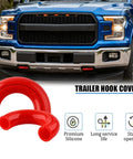 Two Pack Front Tow Hook Covers For Ford F-150 2004-2025 Front Bumper OEM Style Red Replacement Accessories That Snap In Easy And Keep Your Truck Looking Sharp showing red tow hook covers on a blue truck.