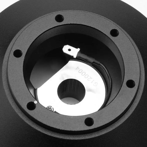 Detailed view of Power Heavy Slick Short Steering Hub Quick Release Adapter Aluminum, showing dual spring locking mechanism for trucks.