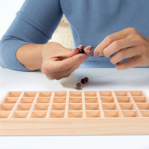 Dope Stackable Jewelry Organizer Tray Featuring Thirty Six Durable Wooden Grids For Sorting Beads Bracelets Pendants And Earrings being used for crafting.