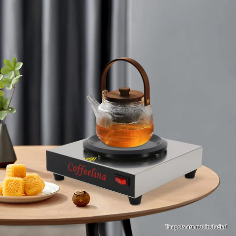 Keep Your Morning Brew Piping Hot With This Rugged Stainless Steel Coffee Warmer Plate Featuring Auto Shut Off And Sturdy Grip Base Built Tough For Corporate Break Rooms Local Diners And Weekend Brunch Stations on a tabletop with a teapot.