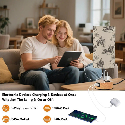 Couple using Cowboy Watercolor Decor Bedside Lamp With 3-Way Dimmable Touch Control And Built-In Charging Station with devices.