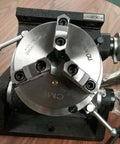 Precision Tilting Rotary Table With Three Jaw Chuck And Six Inch Centering Adapter, heavy duty steel construction, top view.