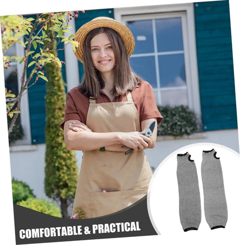 Tough As Nails Cut Resistant Arm Sleeves With Thumb Hole Grip in a garden setting, suitable for mechanics and gardeners.
