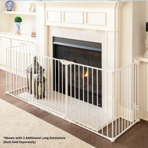 Extra Wide Walk Through Baby Gate, Customizable Safety Barrier Fits From 35.4 To 82.7 Inches, Includes Two Extendable Sections, Easy Walk Through Door, Perfect For Fireplaces, Large Openings Or Unique Stairways, White in front of fireplace