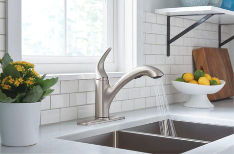 Medina Spot Resist Stainless One Handle Pull Out Kitchen Faucet With Power Clean Sprayer installed over a sink