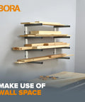 Heavy Duty Four Tier Lumber Storage Rack For Garage And Workshop Space Saving Metal Board Shelf For Plywood Pipes And Building Materials White Gray mounted on wall with timber support.