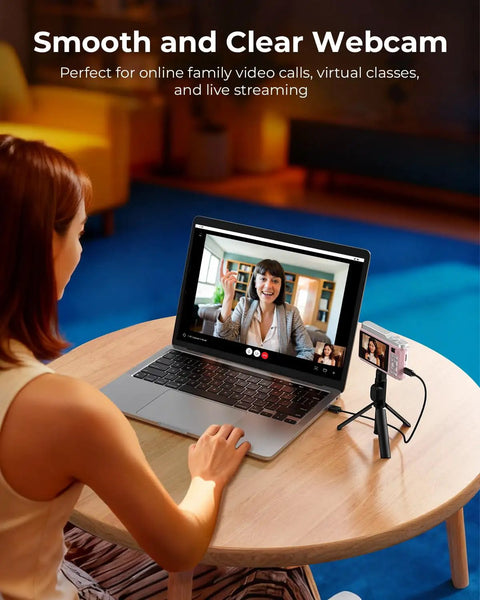 Fire Pink Wifi Digital Camera For Kids Featuring Switchable Dual Lenses And Crisp 4K Capture Point And Shoot Option With Sixteen X Zoom Anti Shake Tech Super Portable Compact Design Prime Gift For Cool Teens on a laptop during a video call.