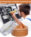 Man applying Electrical Grease Conductive Paste For Automotive And Electronics Copper Anti Seize Compound High Temperature Tune Up on circuit board.