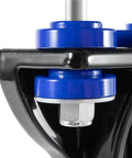 Close-up of Peterbilt 377-379 lower hood pivot kit part with black bracket and blue bushing for smooth hood operation, OEM replacement.