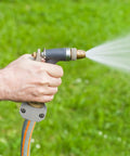 Spraying water using Garden Hose Repair Kit With Aluminum Fittings, 4 Male And 4 Female End Connectors, 5/8 and 3/4 inch hoses