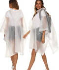 Two models wearing 2 Pack Reusable Adult Rain Ponchos Emergency Waterproof Rain Coat With Drawstring Hood Heavy Duty EVA Gear Tear Resistant Quick Dry White
