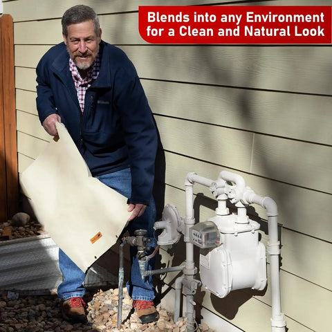 Man installing Cold Snap Backflow Preventer Insulation Cover For Outdoor Winter Protection 36 Inch Wide By 30 Inch High Beige Water Meter And Well Pump Cover Keeps Pipes From Freezing Heavy Duty Sprinkler Cover next to house pipes.