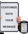 Person holding Custom Metal Sign 18 X 12 Inches With Your Own Message, reflective aluminum for outdoor use.