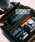 Inner view of Camera Pack 25L With Ladder And Two Small Camera Cubes For DSLR Gear, organized compartments visible.