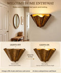 QUOLM Vintage Bronze Wall Sconce, Scalloped Uplight Wall Lamp, E26, showing light on and off in an entryway.