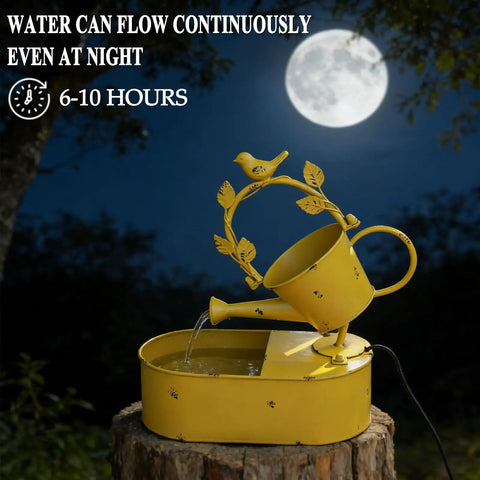 Front view of a yellow solar powered outdoor water fountain with battery backup for garden bird bath yard decor, premium metal water feature for patio and lawn, no hassle run time of 6 to 10 hours at night on sunny days, depicted at night with moon backdrop.