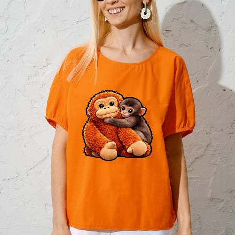 Woman wearing orange shirt with Monkey Vibe DTF Transfers Set For T Shirts Ready To Press Heat Vinyl Stickers 7x7 bold graphics