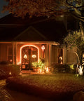 Orange LED Lit Flame Bulbs With Four Modes Indoor Outdoor Use 3W E26 E27 2 Pack illuminating a house at night