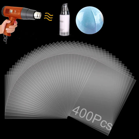 Clear PVC Shrink Wrap Bags 4x6 Inches With Heat Seal 400 Pcs Pack, shown with heat gun and bath bomb in background.