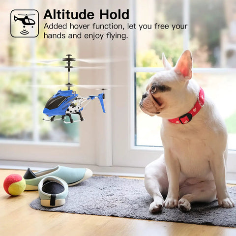 SYMA S107H Mini RC Helicopter With Gyro And Altitude Hold One Key Take Off And Landing Two Point Four GHz Indoor Outdoor Flyer For Adults And Kids Blue hovering by a dog indoors.