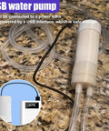 Heavy Duty Oil Extractor Pump With 5V Portable Electric Fluid Siphon And Extended Hose, clear tubes on countertop.