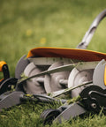 Eco Friendly Push Lawn Mower With 18 Inch Cut, Manual Reel Design, No Gas Or Cords, Inertia Drive Power for a Cleaner Cut, shown from side