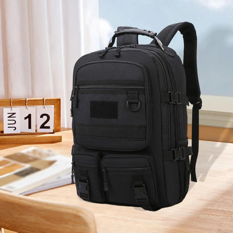 Black rugged hiking backpack for outdoor adventures and weekend trips, daypack travel pack with all weather durability on a table