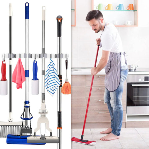 Heavy Duty Wall Mounted Broom And Mop Holder With Four Racks And Five Hooks That Hold Up To Two Hundred Pounds Stainless Steel Tool Organizer For Garage Kitchen Garden Durable Rustproof Hanger For Quick Tidy Storage holding brooms and mops in a kitchen scene.