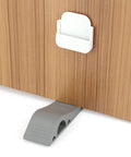 Door Stopper Wedge Set Four Pack Soft TPR Rubber Stoppers holding a wooden door open, showcasing durable non-slip design.