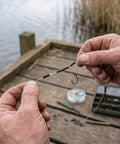 Top Shelf Copper Wire Rope Tube Connectors For Serious Angler Leader Rigging Saltwater Trolling And Bottom Fishing Crimp Sleeves attached to fishing line.