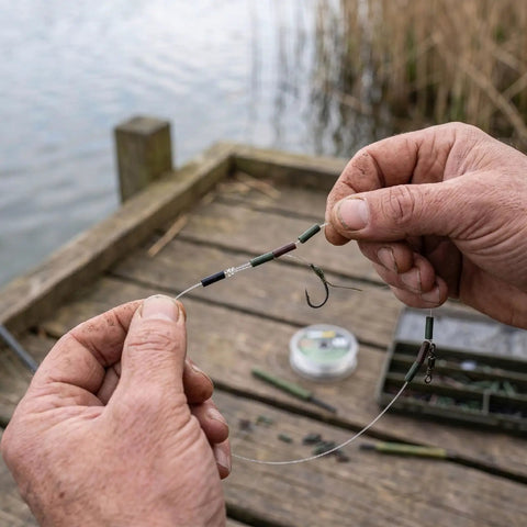 Top Shelf Copper Wire Rope Tube Connectors For Serious Angler Leader Rigging Saltwater Trolling And Bottom Fishing Crimp Sleeves attached to fishing line.