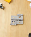 Vintage Iron Square Hinges Set For Furniture And Cabinets, Stable Flat Hinges With Easy Install, on wooden background.