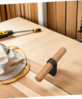 Solid Wood Cabinet Handle Black Drawer Pulls With Single Hole installed on light wood surface, next to tools.