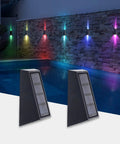 Solar RGB Wall Lights For Outdoors Waterproof Fence And Stair Lighting 7 Color Changing LED Pathway Patio Garden Lights Auto Or Steady Color Modes Perfect For Backyard Garage Yard 8 Pack mounted by a poolside wall