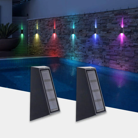 Solar RGB Wall Lights For Outdoors Waterproof Fence And Stair Lighting 7 Color Changing LED Pathway Patio Garden Lights Auto Or Steady Color Modes Perfect For Backyard Garage Yard 8 Pack mounted by a poolside wall